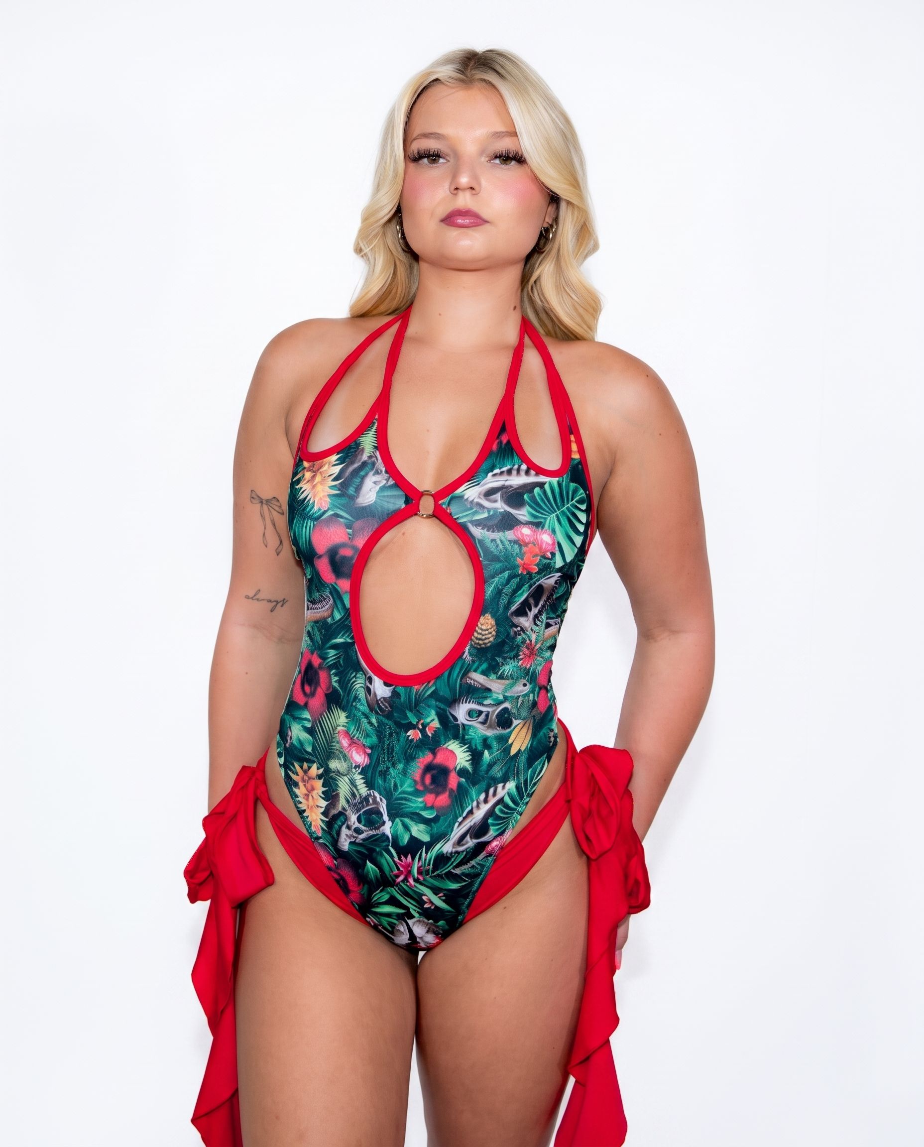 Florasaur Cross Faded Bodysuit: botanical dinosaur skull print halter bodysuit with red trim by Freedom Rave Wear, handmade in San Diego